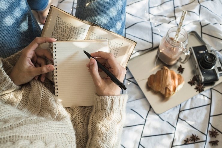 Psychology of Routine: Why Your Brain Craves Predictability Crop Woman Making Notes Near Camera Breakfast Food 23 2147911477
