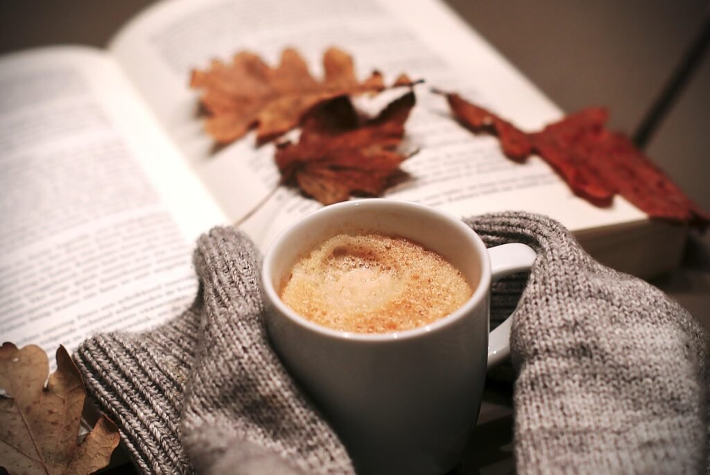 Relaxing moment with a warm drink, representing digital-free activities that promote mindfulness and stress relief.