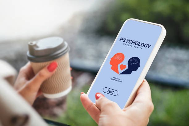 A user engaging with a mindfulness apps on their phone, which shows psychology and relationship content, highlighting the convenience of mobile mental health resources.