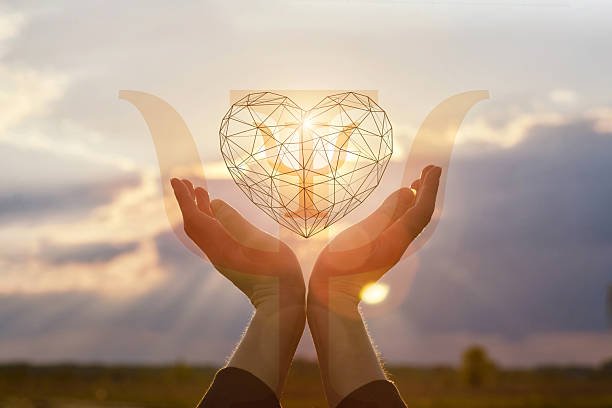 Cupped hands gently support a red heart featuring a white psychology symbol, visually representing Creating a Support System for Mental Wellness.
