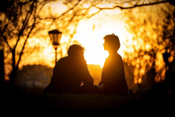 A friend offers comfort and support to a loved one while discussing mental wellness