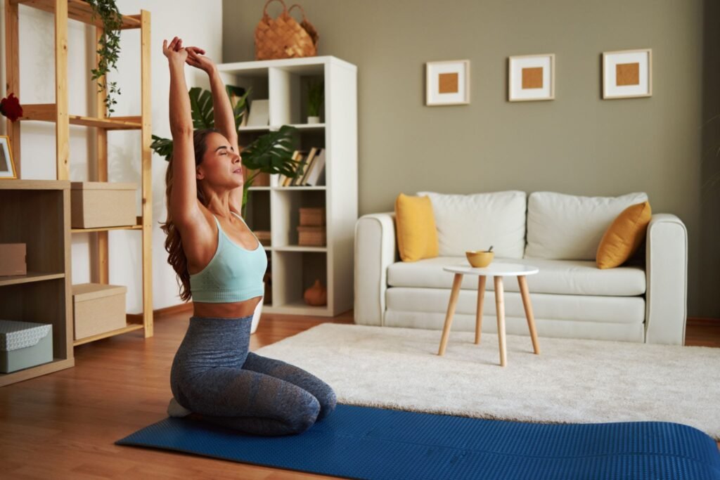 Finding time for wellness with Quick At-Home Workouts, featuring a woman peacefully exercising in her own living room.