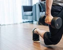A woman demonstrating a lunge as part of a Short Workout Schedules routine that you can do anywhere, anytime.